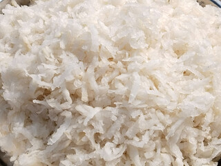 Fresh grated Horseradish on surface background (detailed close-up shot)