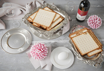passover seder table setup with matzah bread, wine, and traditional symbols, perfect for family gatherings