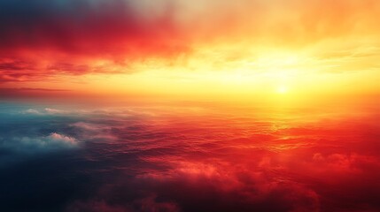 Obraz premium Dramatic sunset over a sea of clouds, vibrant red and orange hues.