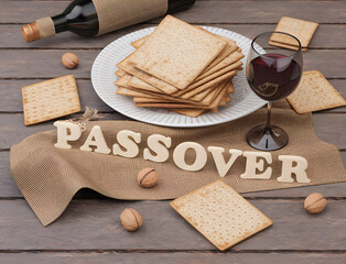 matzah bread and a glass of wine on a rustic table with the word �passover,� reflecting tradition and culture