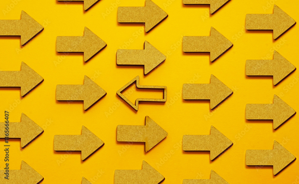 Poster being different, leadership and mindset concept. one pointer indicates direction against the stream,