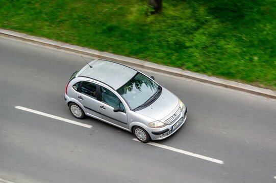Silver Citroen C3 compact French car with motion blur effect