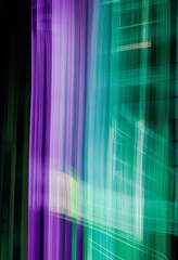 An abstract  skyline at night, captured in motion blur with green and purple lights on buildings