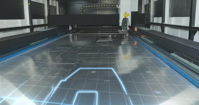 Metal laser cutting machine. CNC laser machine at the factory. CNC laser cutting machine at work. Cutting metal with a laser CNC machine. Factories And Industry. 