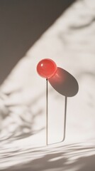 Minimalist Red Sphere on a Stick: A Modern Abstract Still Life Design
