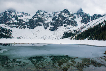 Frozen Lake Morskie Oko or Sea Eye Lake in Poland at Winter. © Roxana