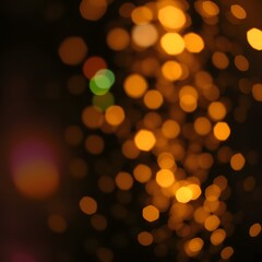 Obraz premium a cluster of warm out-of-focus lights against a dark background creating a bokeh effect