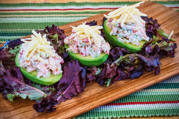 shrimp salad stuffed avocado topped with cheese