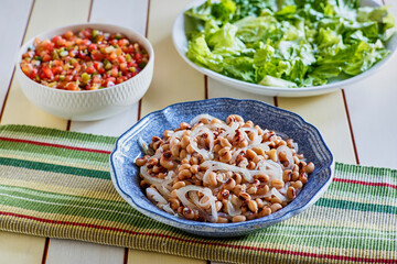 black eye pea salad with mixed greens and tomato salsa