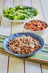 black eye pea salad with mixed greens and tomato salsa