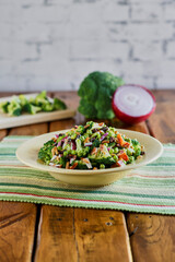 fresh broccoli salad served in a white bowl