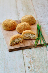 chicken and cream cheese stuffed pizza dough packs served on a cutting board