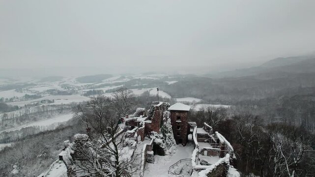 Aerial view ruins of old castle. Winter. Ruin of Hohnstein Castle, Harz mountains, Germany.
