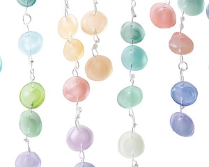 Colorful beads on a string, delicate texture, white isolated background.