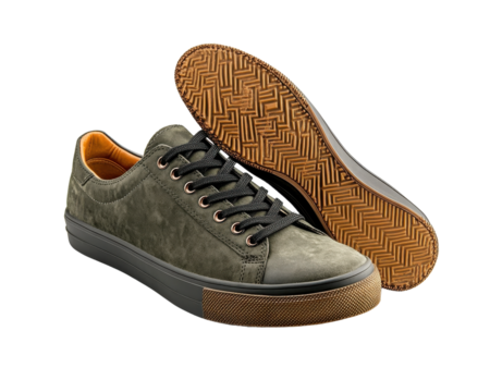Stylish green sneakers on a white isolate background.