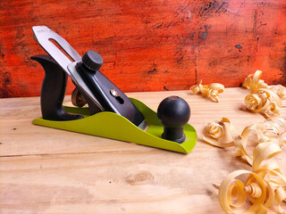 hand plane on wood background