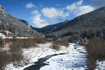 Snow covered rivers in the Rocky Mountains in winter, Peak to peak highway, Colorado