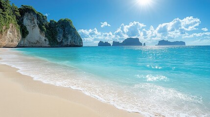 Idyllic tropical beach with turquoise water and limestone cliffs.