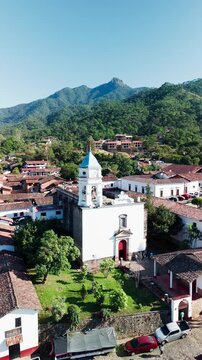 Village church in San Sebastian del Oeste, Mexico. La Bufa hill in the background