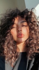 Fototapeta premium Close-up portrait of a woman with curly hair