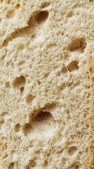 A Detailed Close-up of a Deliciously Baked Loaf of Bread, Showcasing its Texture and Grain