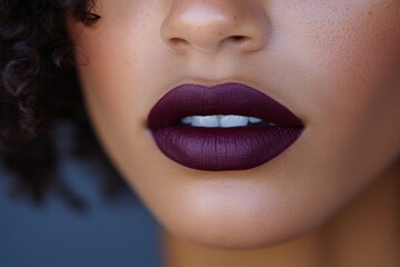 Fototapeta premium Close-up view of a woman's lips with dark lipstick showcasing beauty and makeup artistry