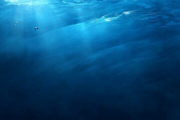 Obraz premium Underwater scene with sunbeams and bubbles.