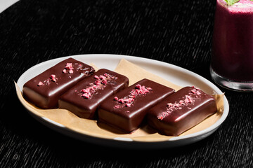 Indulgent and Delicious Chocolate Bars with Various Toppings Displayed on a Plate