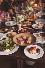 bright and festive table in the restaurant hall. Table setting in the restaurant. Brunch table setting with different delicious food ready for friends home party. A variety of food on the table