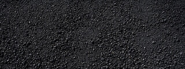 Obraz premium Asphalt texture, close-up view, rough surface, black and gray granules, road paving material, grainy appearance, dark background, construction material, urban infrastructure, detailed macro shot, grit