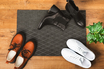 Doormat. Welcome mat on the floor background. Women's shoes on a doormat on background. Interior...
