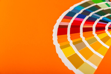 Color palette on a bright colored background. Color palette guide. paper catalog of rainbow color....