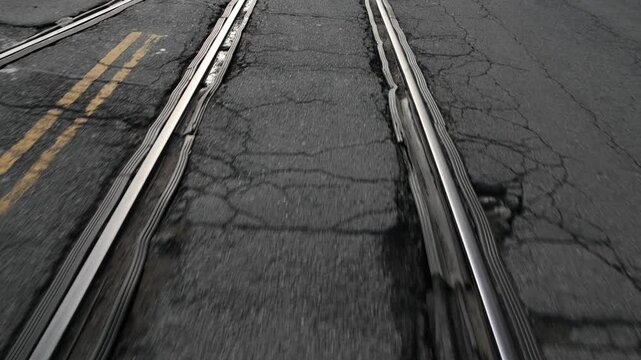 riding on rails inside concrete (paved over abandoned railroad tracks) sunset park brooklyn industry city (rail ties track track) street pavement asphalt repave repaved urban street car biking lane