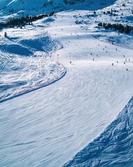 Obraz premium Winter sports competitions at majestic snowy slopes alpine region aerial view thrilling action and adventure