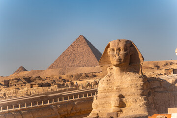 Great Sphinx of Giza at sunrise with the pyramid in the back