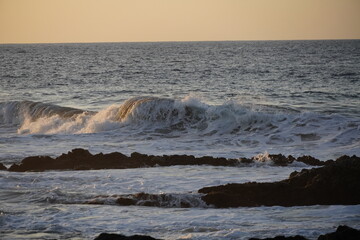 Autumn afternoon watching the sunset and waves from the cliff