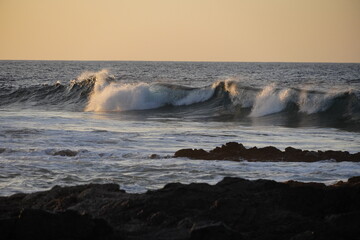 Autumn afternoon watching the sunset and waves from the cliff