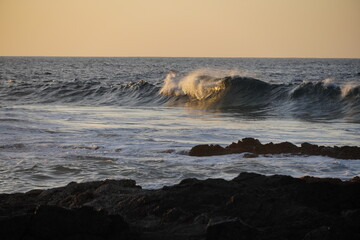 Autumn afternoon watching the sunset and waves from the cliff