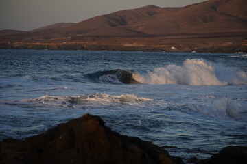 Autumn afternoon watching the sunset and waves from the cliff