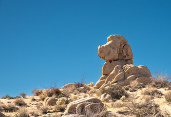 Rock Formation That Looks Like A Hound Dog Against A Blue Sky