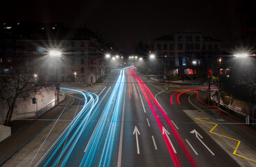 Wave motion speed red and blue lighting background, the movement of the lights with curve through the Zurich streets