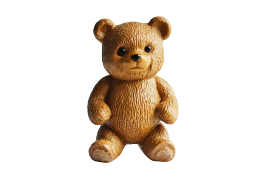 Cute teddy bear figurine made of resin sitting on a white background