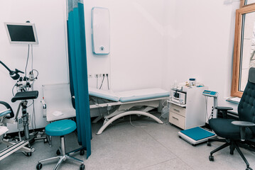 Interior of gynecologist office hospital, bright room with medical equipment