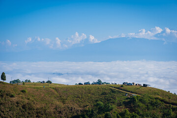 Obraz premium Beautiful natural scenery of cloudscape the sea of mist in the morning at Doi Ba Lu Kho Mountain View Point Campground at Mae Chaem, Chiang Mai, Thailand. Background Happy holiday recreation.