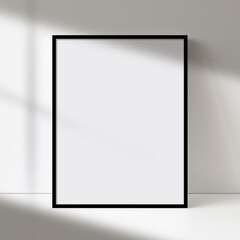 Black picture frame art, poster, or painting mock-up with blank canvas, soft natural light, and shadow on a neutral wall. Perfect for showcasing artwork or designs.