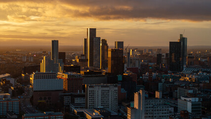 The golden hour highlights the stunning cityscape of Manchester, as the low sun creates a beautiful...