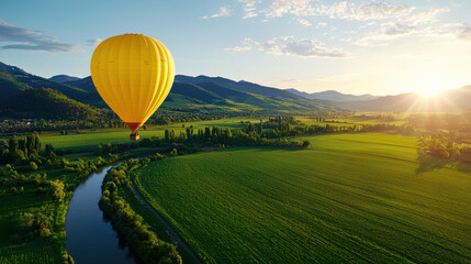 Obraz premium hot air balloon gently floating over beautiful green landscape, with rolling hills and river reflecting sunlight. scene captures tranquility and adventure