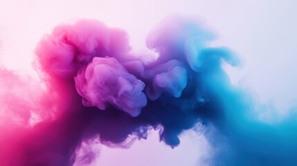 Fototapeta premium Abstract colorful smoke swirling in shades of pink and blue against a soft background.