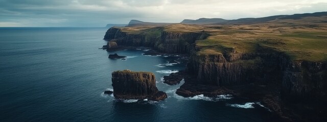 A breathtaking aerial perspective of rugged sea cliffs and natural arches along the coast of Isle of Skye, Scotland, Isle of Skye coastal cliffs scene