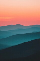 Obraz premium Serene mountain landscape at sunset with soft, layered hues.